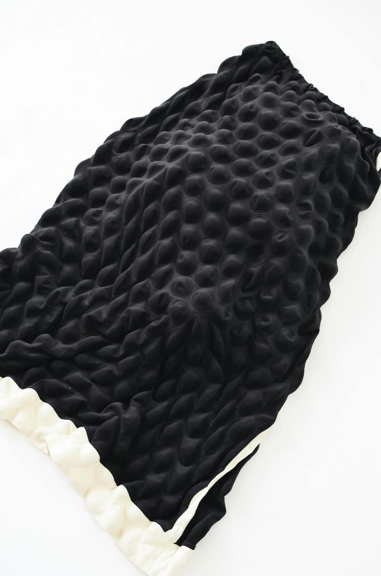 Stylish black skirt on white background